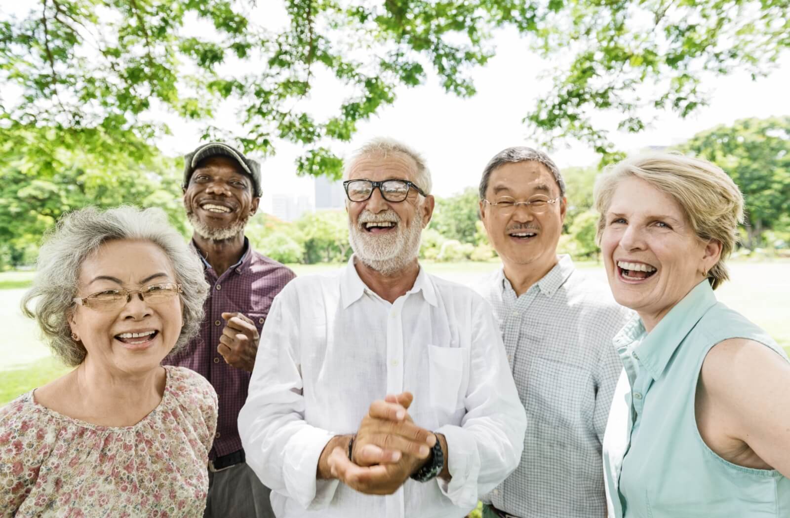 A group of older adults enjoys time outdoors in their independent living community.